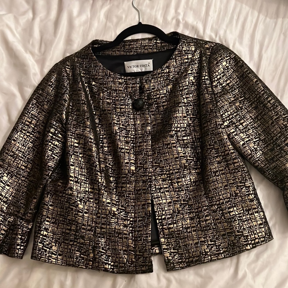 Beautiful gold and black blouse . Need gone asap!!